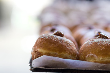 Hanukkah donuts (sufgania) are delicious and sweet in honor of Chanukah (the winter Jewish holiday in memory of miracles and wonders). Filled with strawberry jam or milk jam and deep-fried.