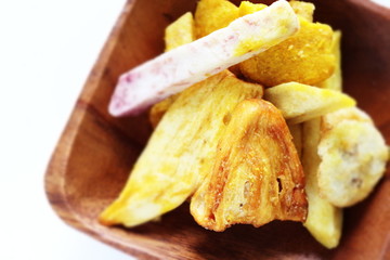 Thai food, deep fried jack fruit and yam on wooden plate