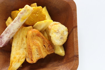 Thai food, deep fried jack fruit and yam on wooden plate