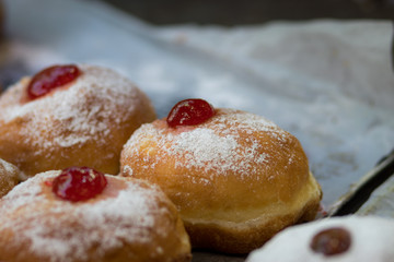 Hanukkah donuts (sufgania) are delicious and sweet in honor of Chanukah (the winter Jewish holiday in memory of miracles and wonders). Filled with strawberry jam or milk jam and deep-fried.