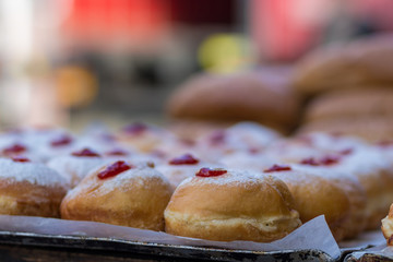 Hanukkah donuts (sufgania) are delicious and sweet in honor of Chanukah (the winter Jewish holiday in memory of miracles and wonders). Filled with strawberry jam or milk jam and deep-fried.