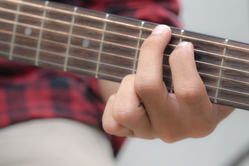 Acoustic Guitar Playing. Men Playing Acoustic Guitar Closeup Photography.