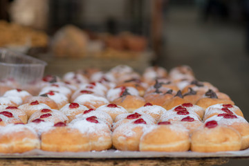 Hanukkah donuts (sufgania) are delicious and sweet in honor of Chanukah (the winter Jewish holiday in memory of miracles and wonders). Filled with strawberry jam or milk jam and deep-fried.