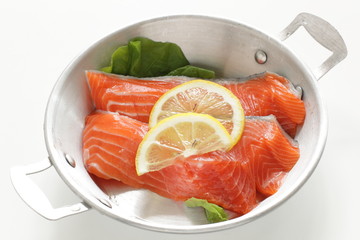 Freshness salmon and lemon on stainless steel pan