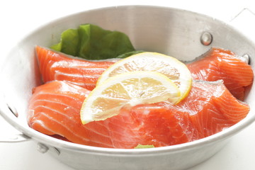 Freshness salmon and lemon on stainless steel pan