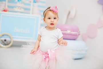 First birthday party for little girl princess. Infant girl on her first birthday party