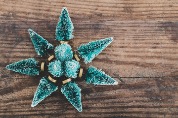 festive season's decorations group of miniature Christmas trees placed in shape of star