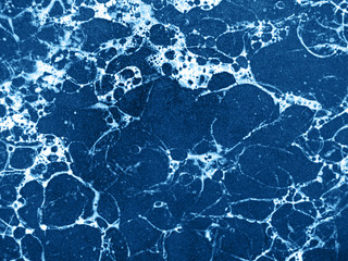 Marble background toned classic blue color