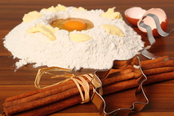 Pile of flour, egg and butter. Making Christmas Gingerbread Cookies