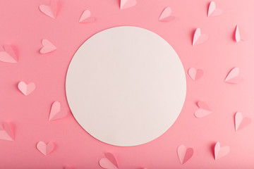 Fototapeta na wymiar pink pastel background with white circle and hearts