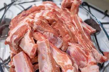 Close up of pile of raw pork ribs