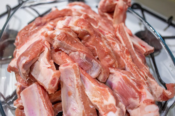Close up of pile of raw pork ribs