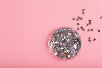silver sequins on a pink background