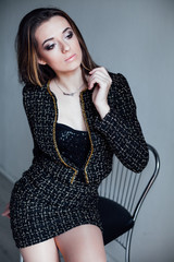 fashion portrait of a woman with long hair in a white room