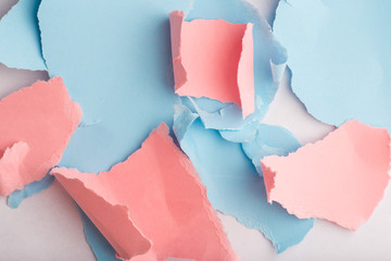 pieces of ragged colored paper on the table