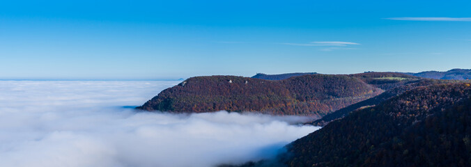 Germany, XXL panorama aerial view above beautiful endless foggy clouds in valley of swabian jura...