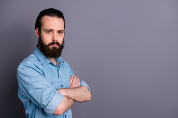 Profile photo of macho guy serious perfect appearance neat long hairdo bristle young chief arms crossed not smiling wear casual denim outfit isolated grey color background