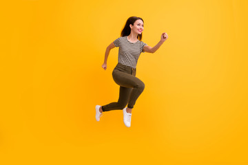 Fototapeta na wymiar Full body profile side photo of motivated cheerful girl jump run want hurry after black friday bargains wear modern clothing isolated over bright color background