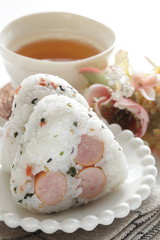 Japanese food, sausage and rice ball on dish