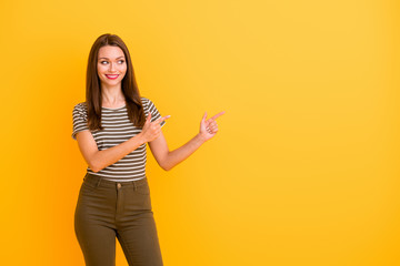 Portrait of positive cheerful girl promoter point index finger copy space suggest select promotion...