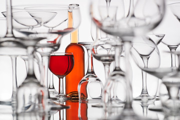 different glasses with a red drink on a white background