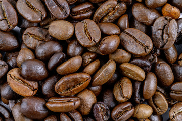 Roasted coffee beans closeup. Background texture.