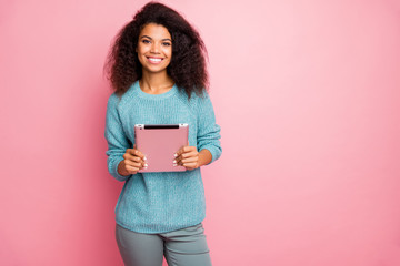 Portrait of her she nice-looking attractive lovely charming pretty cheerful cheery wavy-haired girl holding in hands tablet working remotely isolated over pink pastel color background