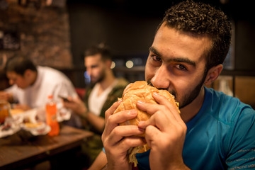 Guy eating burger