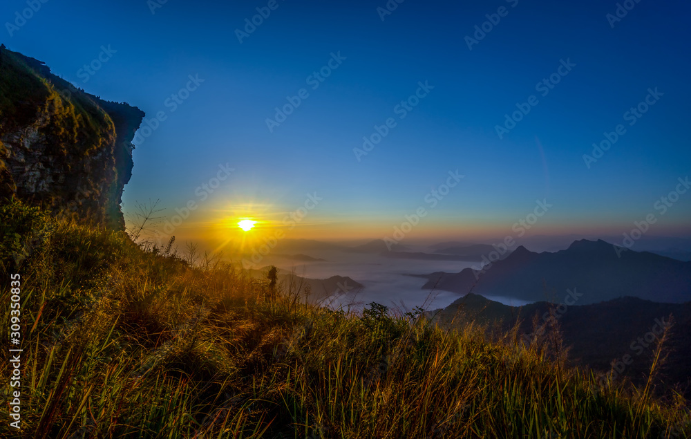 Wall mural sunrise and sea of mist, mountain at phu chee fa or phu chi fa in chiangrai province ,thailand.