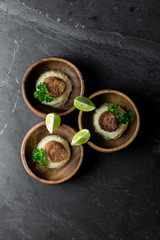 Scallops on Mashed Potatoes with Lime on Slate