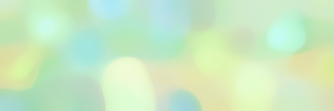 blurred horizontal background with tea green, pastel blue and pale turquoise colors and free text space
