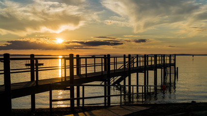 Fototapeta premium old wooden pier at sunset