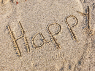 Top view of happy sign made of sand 