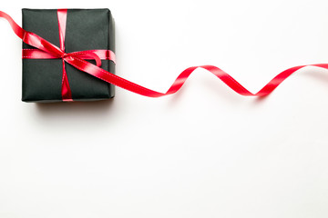Gift box ribbon. Christmas gifts, red decor on white background top view. Xmas present. Winter xmas holiday. New Year. Noel. Flat lay