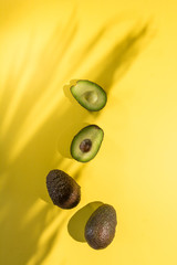Avocados cut on a background of color