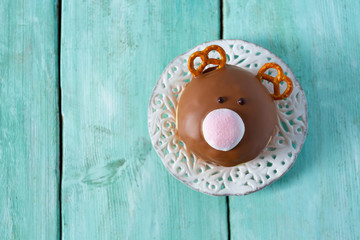 reindeer doughnut on turquoise surface