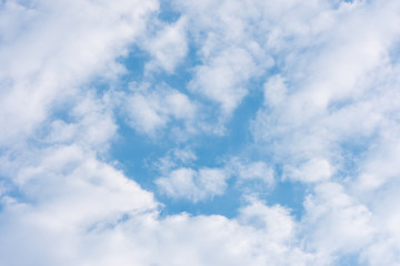 Fototapeta premium blue clouds on the sky in the rays of the sun in the fall. Landscape background texture, copy space