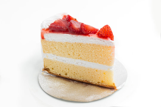 a piece of cake with strawberry on top