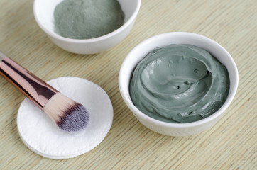 Gray bentonite clay in a bowl. Diy facial mask and body wrap recipe. Copy space.