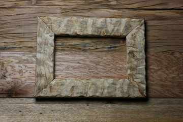 textured frame of wood on an old table of cracked boards as a background