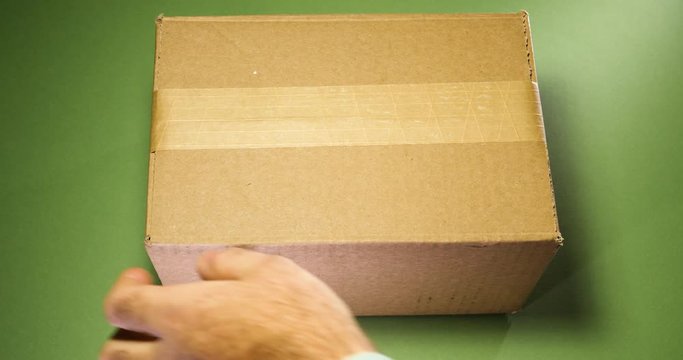 Preparing anticipation of unboxing unpacking cardboard parcel box