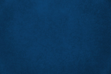 Blue texture painted wall with crack for interior background. Color of the Year 2020 Classic Blue