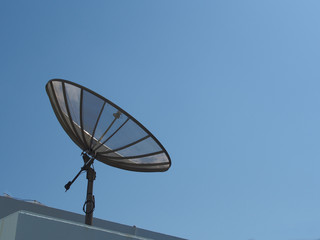 a old style satellite with blue sky