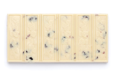 Bar of white chocolate with nuts and raisins isolated on a white background