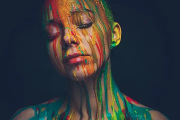 Fotobehang Young woman covered with a colourful paint © Nejron Photo