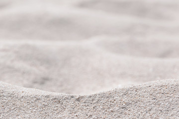Fototapeta na wymiar ิBeautiful sand dunes on a blurred sea background. Outdoor nature