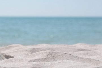 Fototapeta na wymiar Beautiful sand dunes on a blurred sea background. Outdoor nature