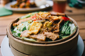Top view of asian food vegan dish on wooden table