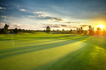 Fotobehang Zonsondergang op de golfbaan © Marek