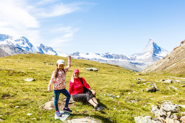 Fototapeta premium Family trekking, mother and daughter camping